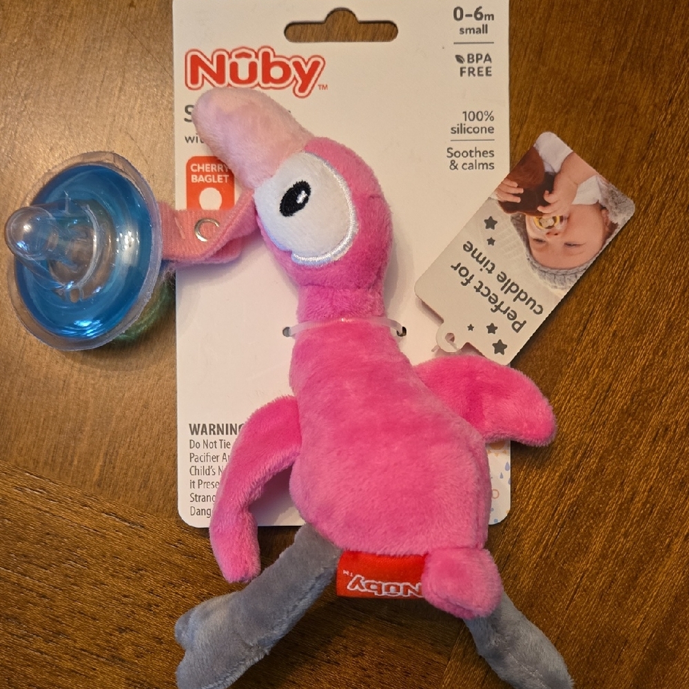 Nuby Flamingo Snuggleez With Pacifer. 0-6 Months